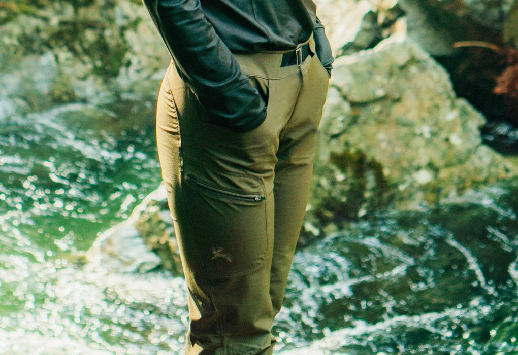 woman wearing hiking pants. They are quick dry pants. She is in the river
